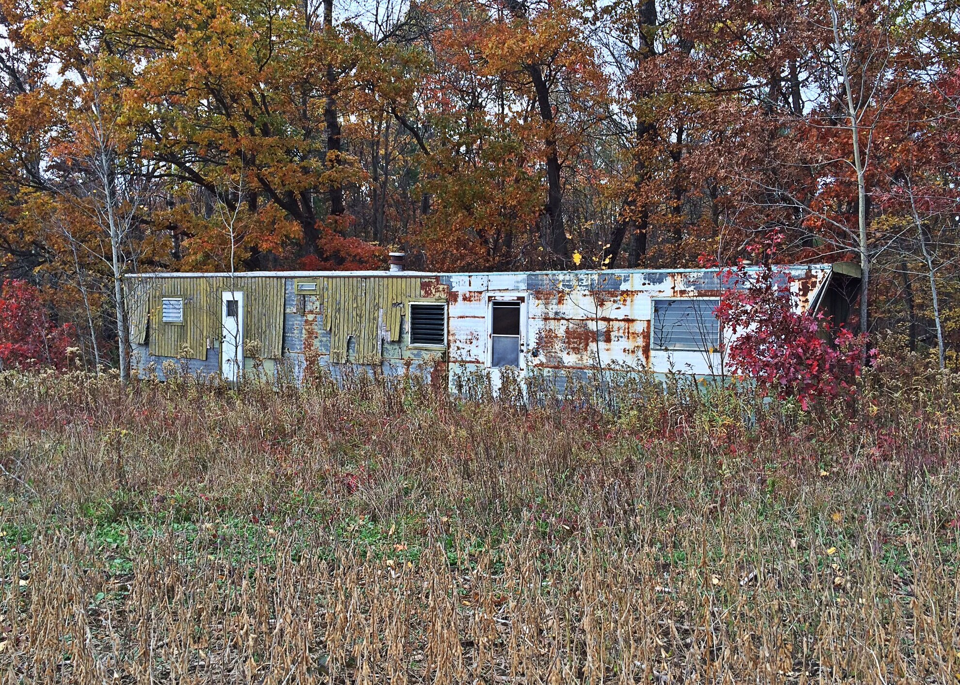 old abandoned single-wide mobile home trailer